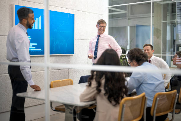 istock Businessman smiling with colleague 1499938100