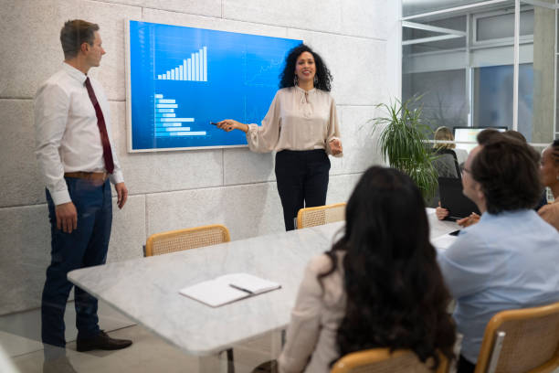 istock Businesswoman giving presentation with graph 1499938123