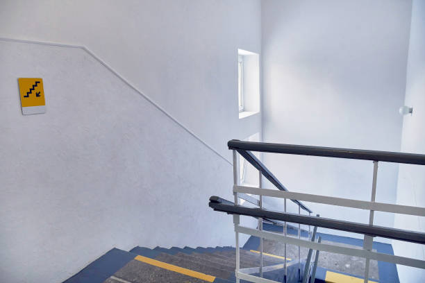 istock Concrete stairs with a handrail and a window. 1499941529