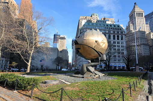 Statue in front of a skyscraper in Manhattan.