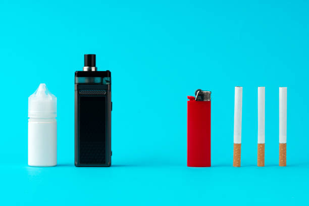 istock Regular cigarettes and electronic cigarette on color background 1499945460