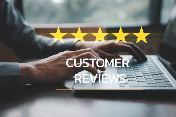 istock man's hand using a laptop with a 5-star popup for customer service satisfaction 1499947778