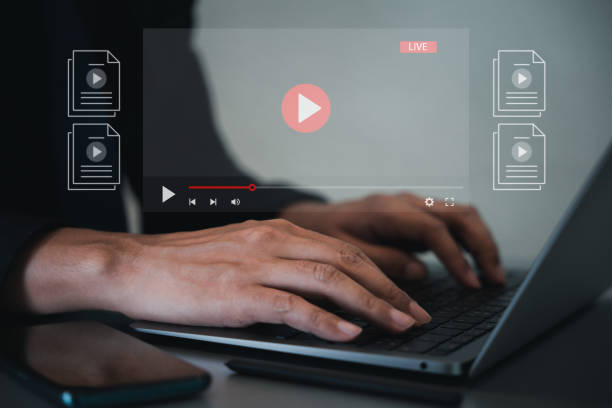 istock Person attending a live webinar on virtual screen streaming online 1499947801