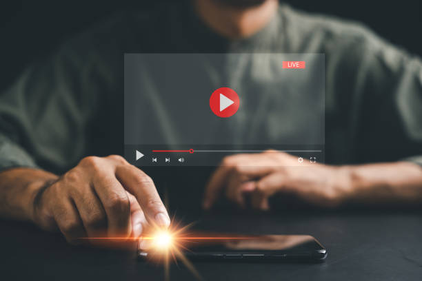 istock Man enjoying video streaming on virtual screen with a smartphone 1499947860