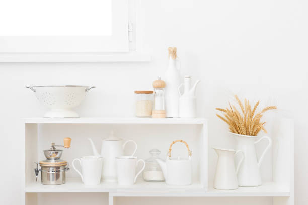 istock White kitchen shelves beneath window with utensils and wheat ears 1499948163