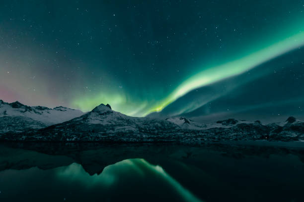 Northern Lights over the Lofoten Islands in Norway during winter stock photo