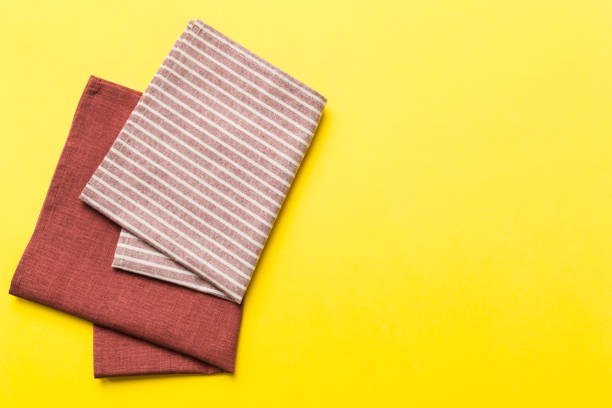 istock top view with red empty kitchen napkin isolated on table background. Folded cloth for mockup with copy space, Flat lay. Minimal style 1499953757