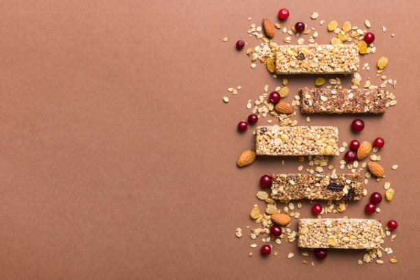 istock Various granola bars on table background. Cereal granola bars. Superfood breakfast bars with oats, nuts and berries, close up. Superfood concept 1499953830