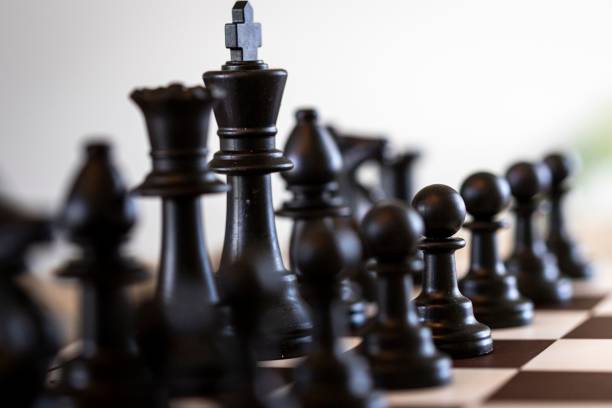 istock Closeup of chess pieces on a chessboard 1499955891