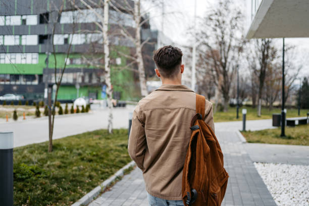Young Man Walking Down The Street