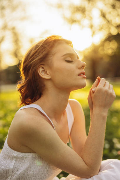 istock Smiling young woman enjoying summer 1499960723