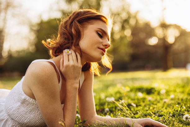 istock Smiling young woman enjoying summer 1499960764