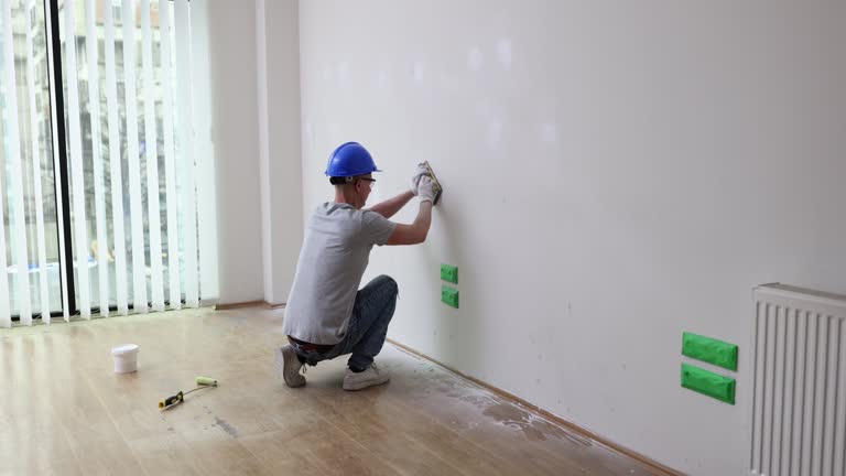 Plastering work on improvement of house and grinding surface of walls