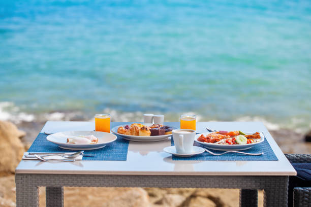 istock Luxury breakfast spread on table with a stunning tropical sea view 1499966291