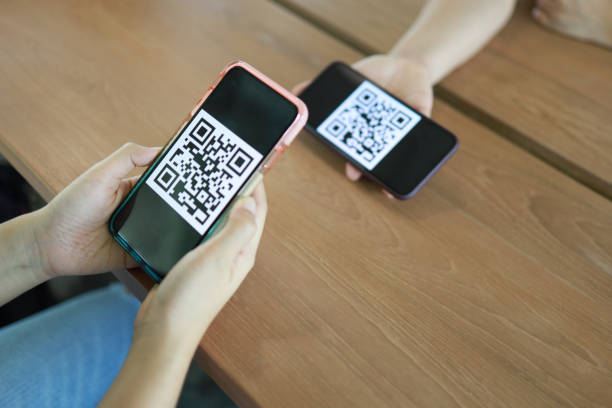 istock Qr code payment. Woman scanning QR code online shopping cashless technology concept. 1499967195