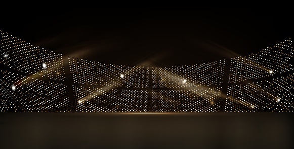 Golden stadium lights with rays, on a dark background. Vector.
