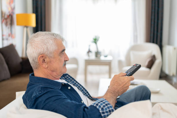 istock Senior Man Enjoys Watching Television At Home 1499970985