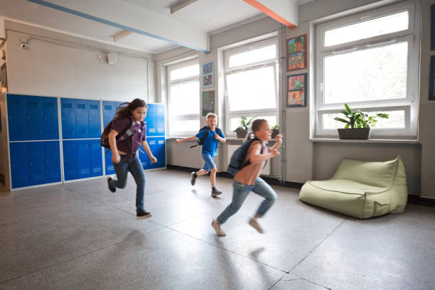 istock School childen runing in the school corridor 1499972484