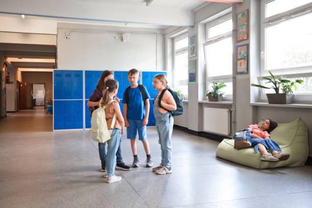 istock School children talking in the school corridor 1499972510