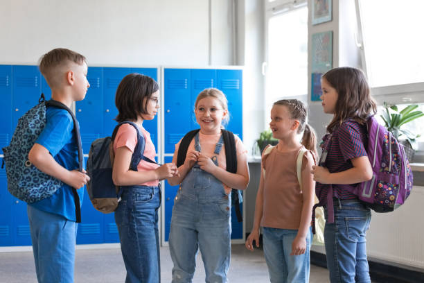 istock School children talking in the school corridor 1499972527