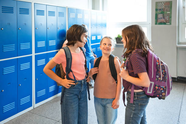 istock School girls talking in the school corridor 1499973251