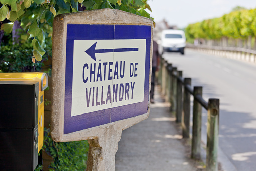 Road sign directing tourists, visitors and vehicles visiting the Chateau of Villandry and it's famous ornamental gardens at the village of Villandry, in the commune of Indre-et-Loire in central France