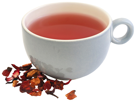Herbal tea of roselle, rose hips and apple in cup