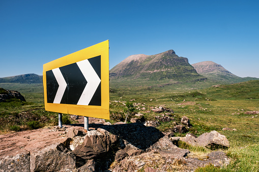 View across the moor towards a mountain called Quinag in the Sutherland region of the North West Highlands of Scotland, a feature on the North Coast 500 road trip.