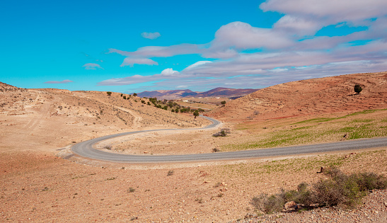 Curved road in desert landscape- Morocco