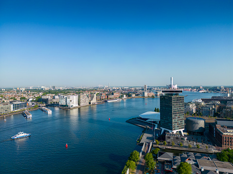 Aerial view of the North shore of the river IJ, Amsterdam. Shot over the river IJ towards the North shore.
