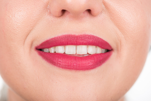 Open Mouth of Woman Face With Pretty Smile and White Teeth. Studio Photo Shoot. Use Bright Red Lipstick.