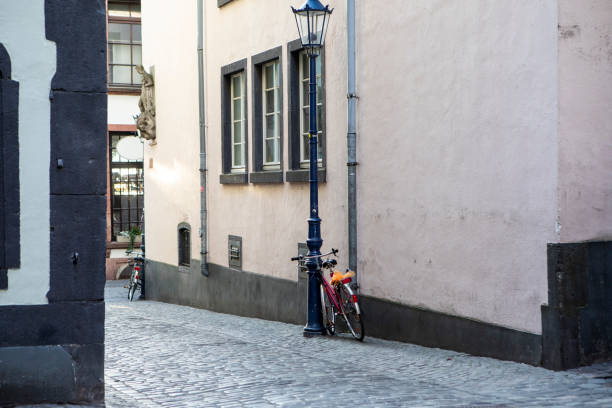 istock Bicycle against a building in an empty cobblestone street 1499982395