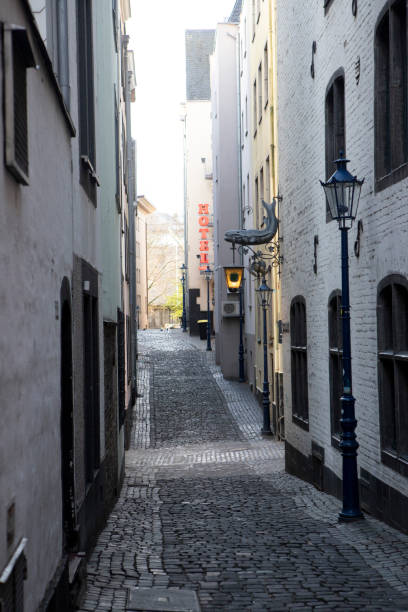 istock Buildings in an empty cobblestone street 1499982593