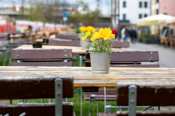 istock Empty cafe tables and chairs with a flower table decoration 1499982733