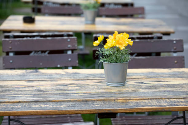 istock Empty cafe tables and chairs with a flower table decoration 1499982736