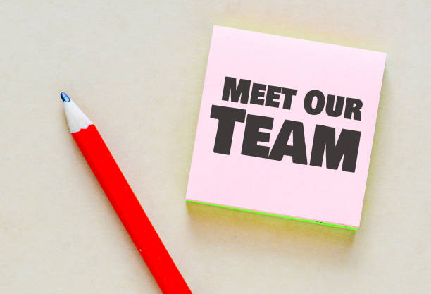 istock Meet Our Team words in an office notebook. 1499989439