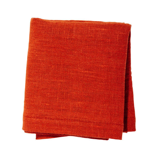 istock Orange color folded cotton napkin isolated. Kitchen towel top view. Element for design 1499989455