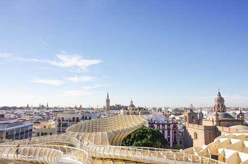 Seville, Spain: October 16, 2014 — A predominantly wooden structure, called Las Setas de Sevilla ( “The Mushrooms of Seville” in Spanish), formerly known as the Metropol Parasol. Las Setas is a popular tourist attraction located at La Encarnación square in the old quarter of Seville.