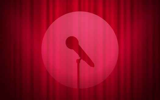 Microphone stage performance stand up comedy red curtain background.