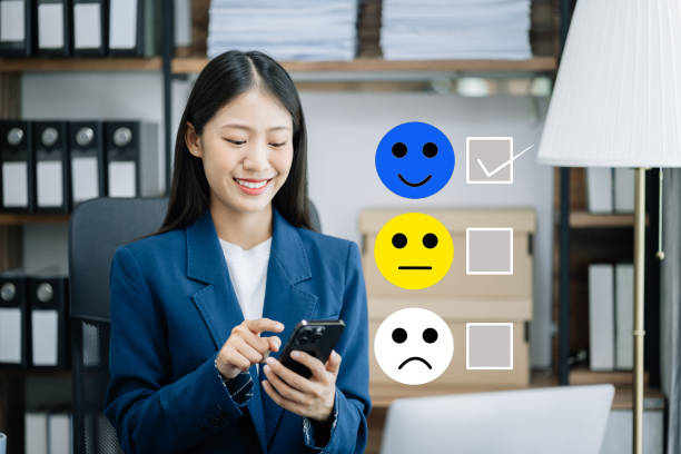 istock Woman holding a digital tablet and smartphone with checkboxes rating smiley faces excellent for Satisfaction Survey, Happy Client Customer Experience concept 1500007149