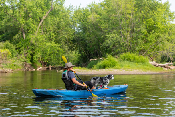 istock Girl & Dog Kayaking Down Rum River in Summer 1500007672