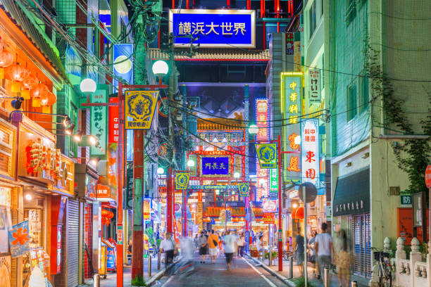 Yokohama, Japan in Chinatown at Night Yokohama, Japan - August 15, 2015: Visitors enjoy Yokohama's Chinatown district at night. It is the largest Chinatown in Japan. kanagawa prefecture stock pictures, royalty-free photos & images