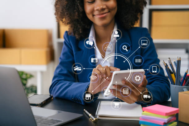 istock Entrepreneur using calculator with pencil in her hand, calculating financial expense at home office, online market packing box delivery,Startup successful small business owner, SME, concept. 1500014504