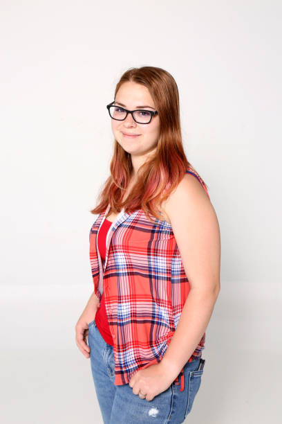 istock Young woman standing in front of white background 1500016977