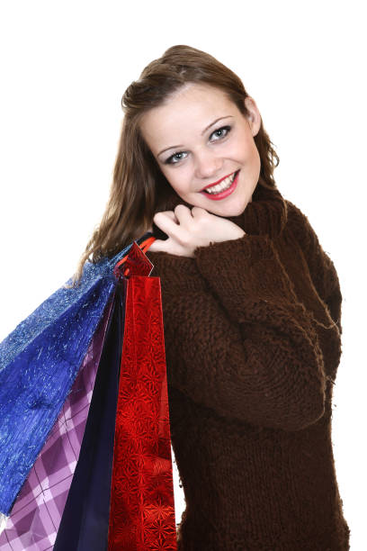 Young womman with shopping bag isolated