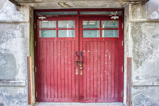 pair of red weathered red wooden doors