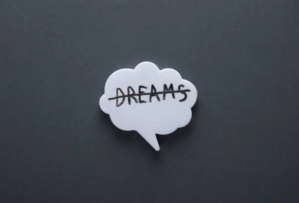 Photo of Broken dream concept. Dialog cloud