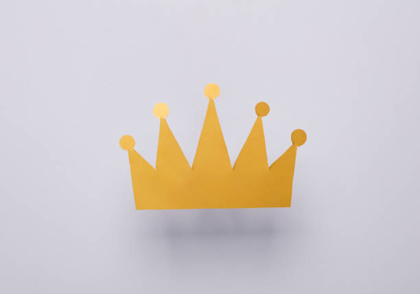 istock Paper golden crown on gray background 1500021381