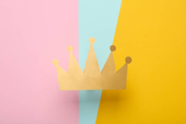 istock Paper golden crown on colored background 1500021388
