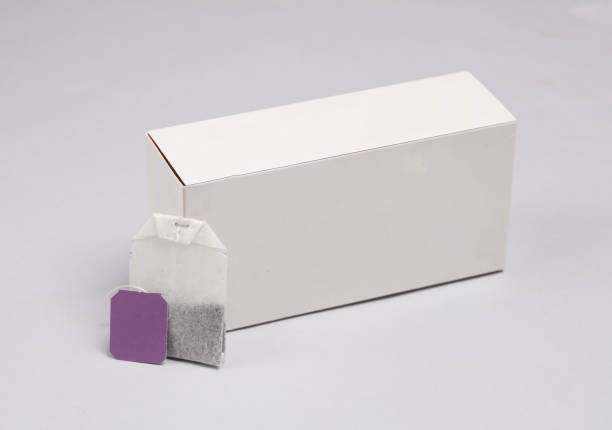 istock Tea bag with label and white box on gray background 1500021807